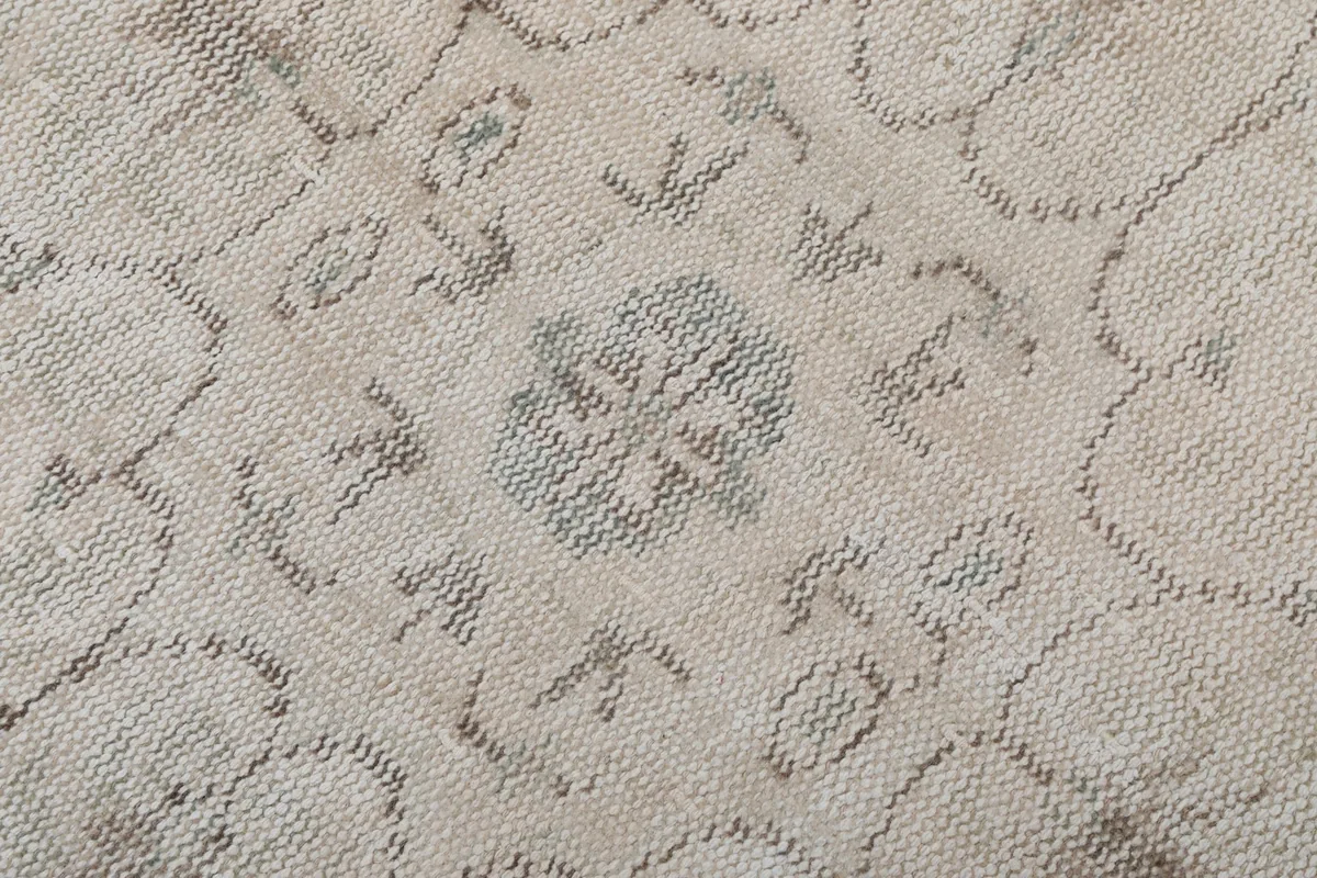 Close-up of the low wool pile, showing the texture and subtle color variations.