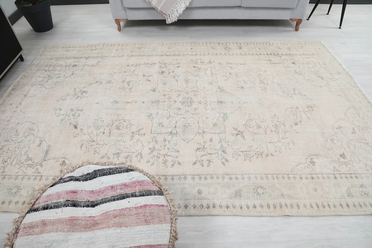 Overhead shot of the rug in the room, emphasizing its large size and overall design.