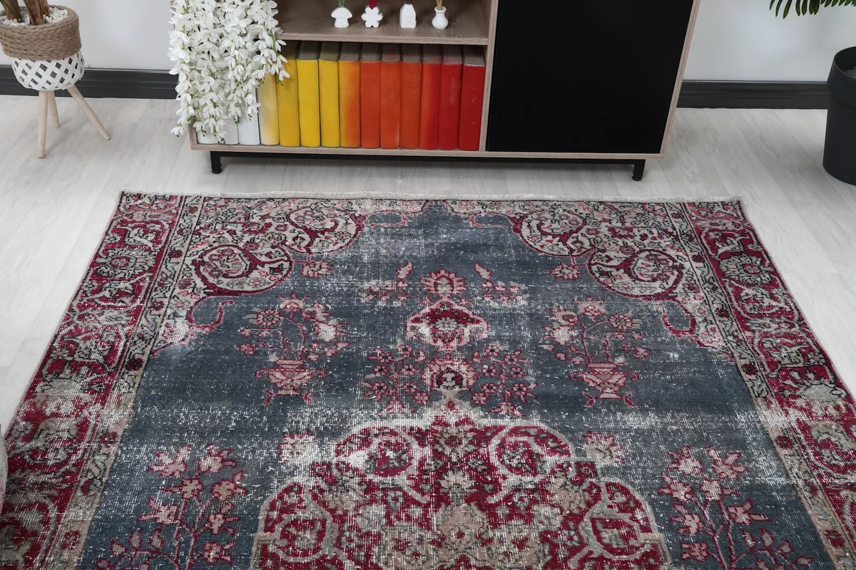 Overhead view of the rug within a room, highlighting its full pattern.