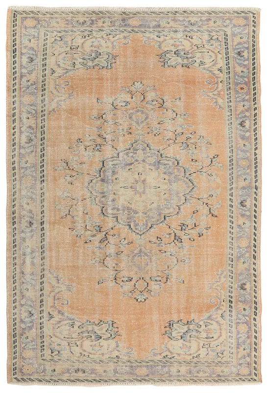 Full top view of the 5'10" x 8'6" vintage Anatolian area rug with faded orange field