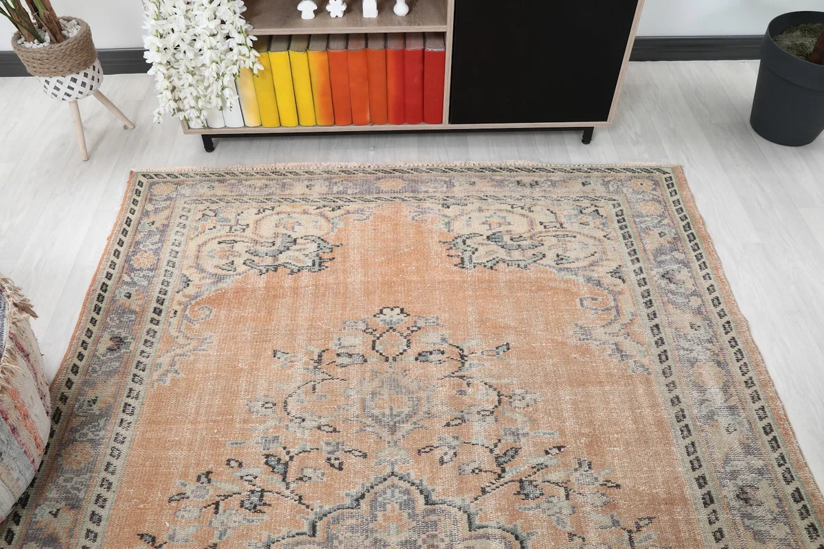 Wide angle view of the vintage orange rug complementing the decor in a contemporary room