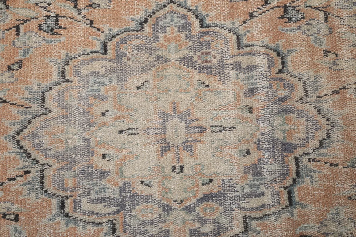 Close-up detail of the central medallion showing the intricate patterns and color variations