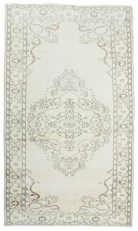 Full overhead view of the ivory floral medallion vintage rug