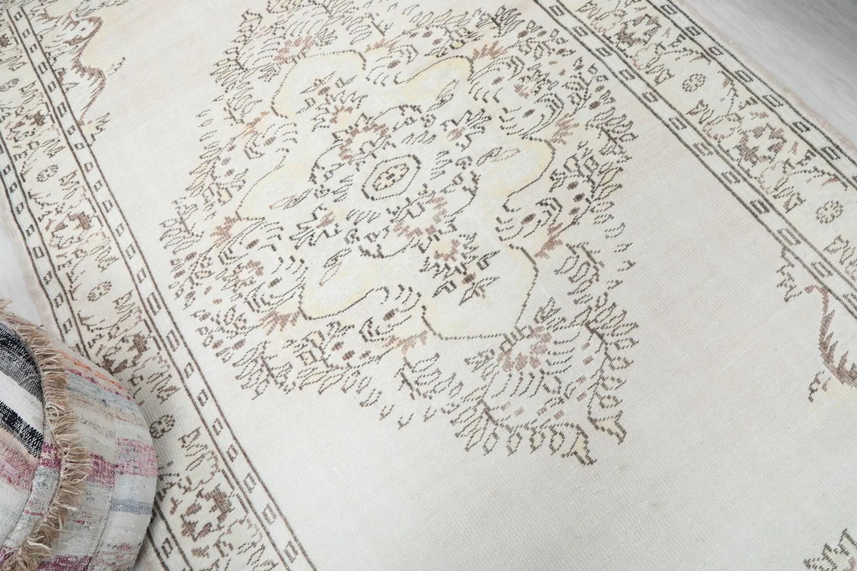 Close view of the central medallion and floral patterns