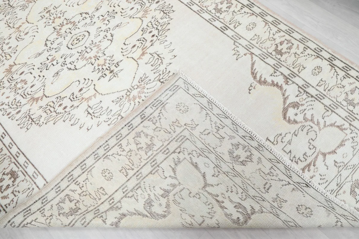 Folded corner revealing the back of the rug and its construction