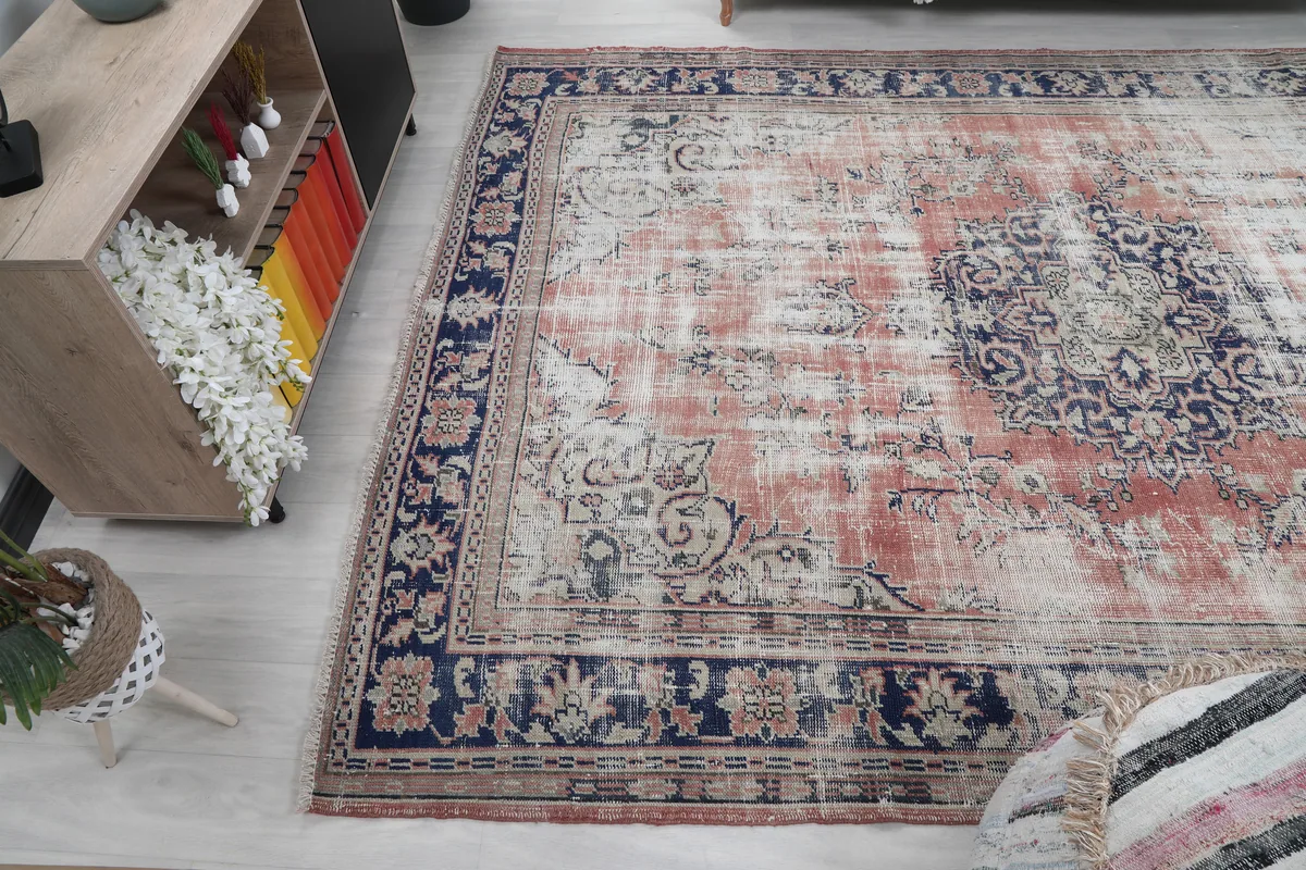 Faded Rose Medallion Vintage Rug in a room setting, showing its integration with home decor.