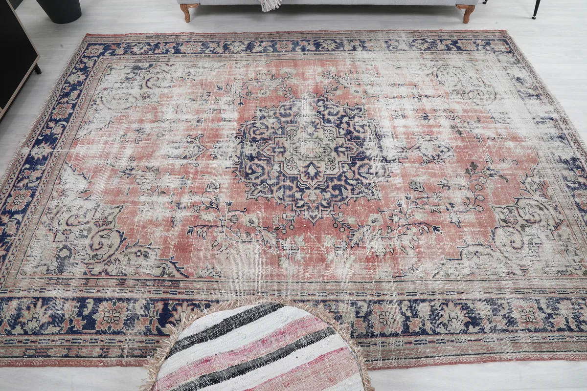 Faded Rose Medallion Vintage Rug in a room, from a slightly elevated perspective.