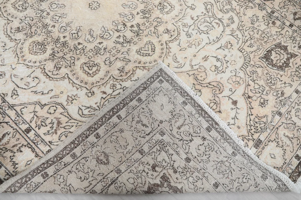 View of the reverse side of the hand-knotted wool rug, showing its construction
