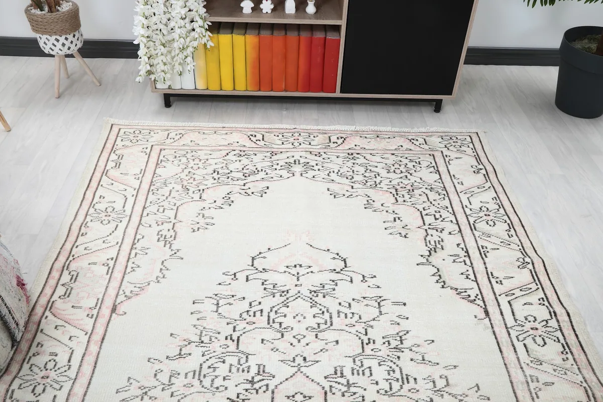 View from one end of the rug, highlighting the symmetrical medallion design.