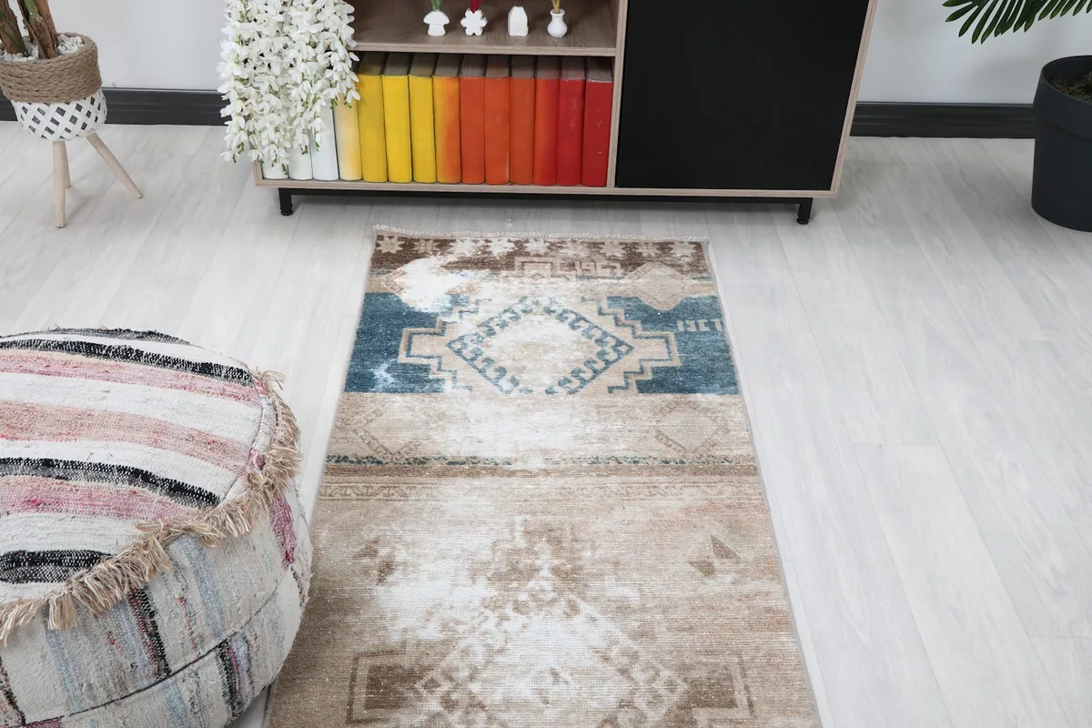 Overhead view of the runner in a room setting, focusing on the blue and beige sections.