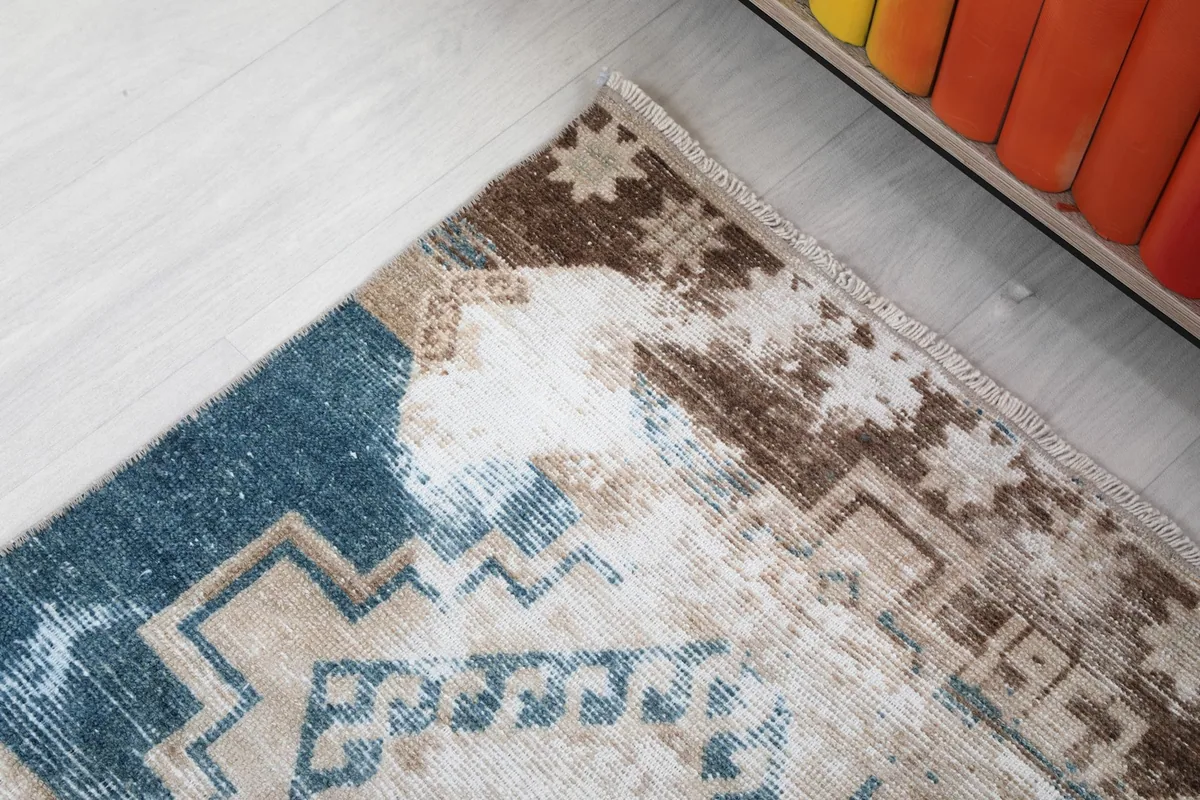 Close-up of the blue and brown geometric patterns at the top section of the runner.