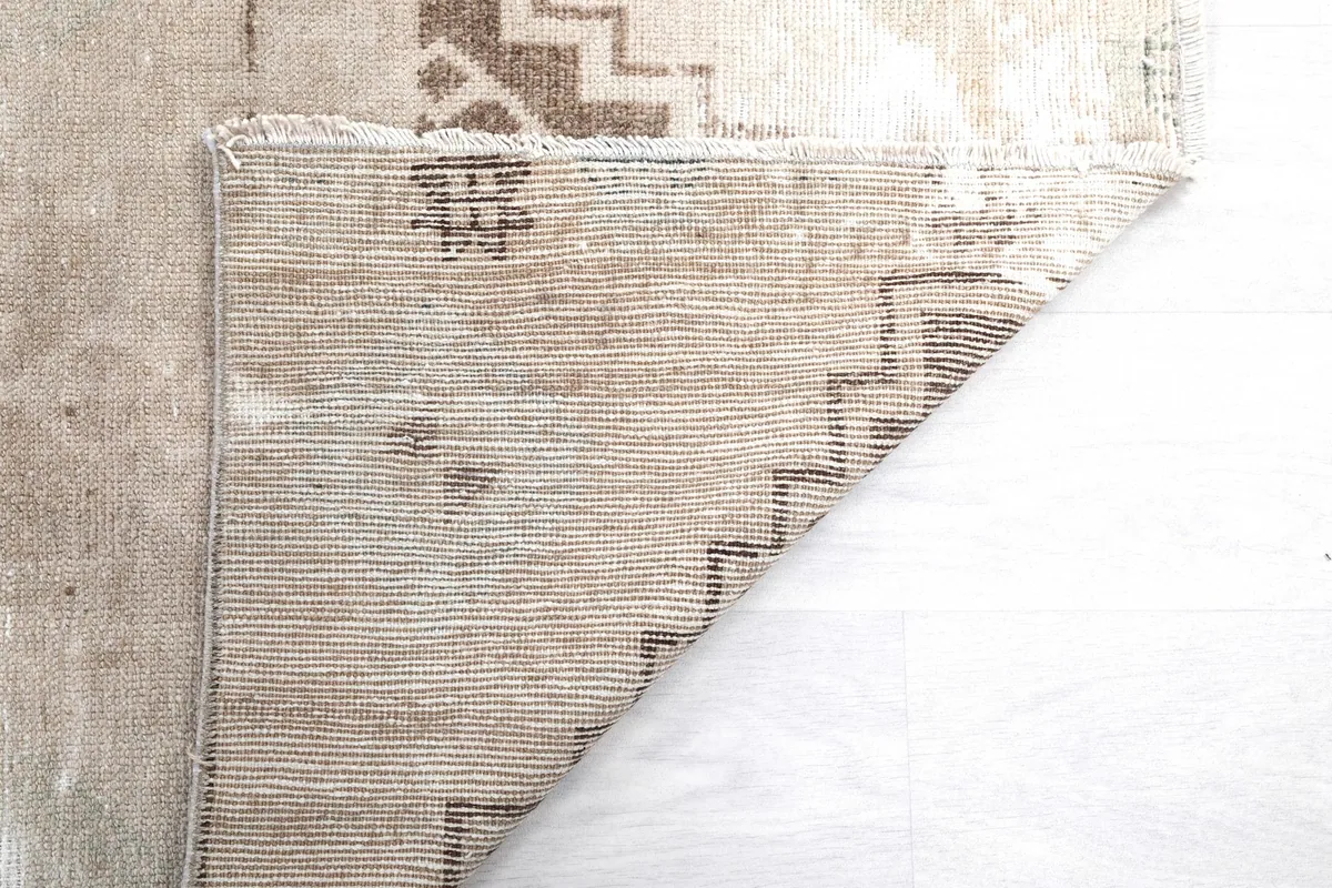Close-up of the hand-knotted construction on the back of the rug.