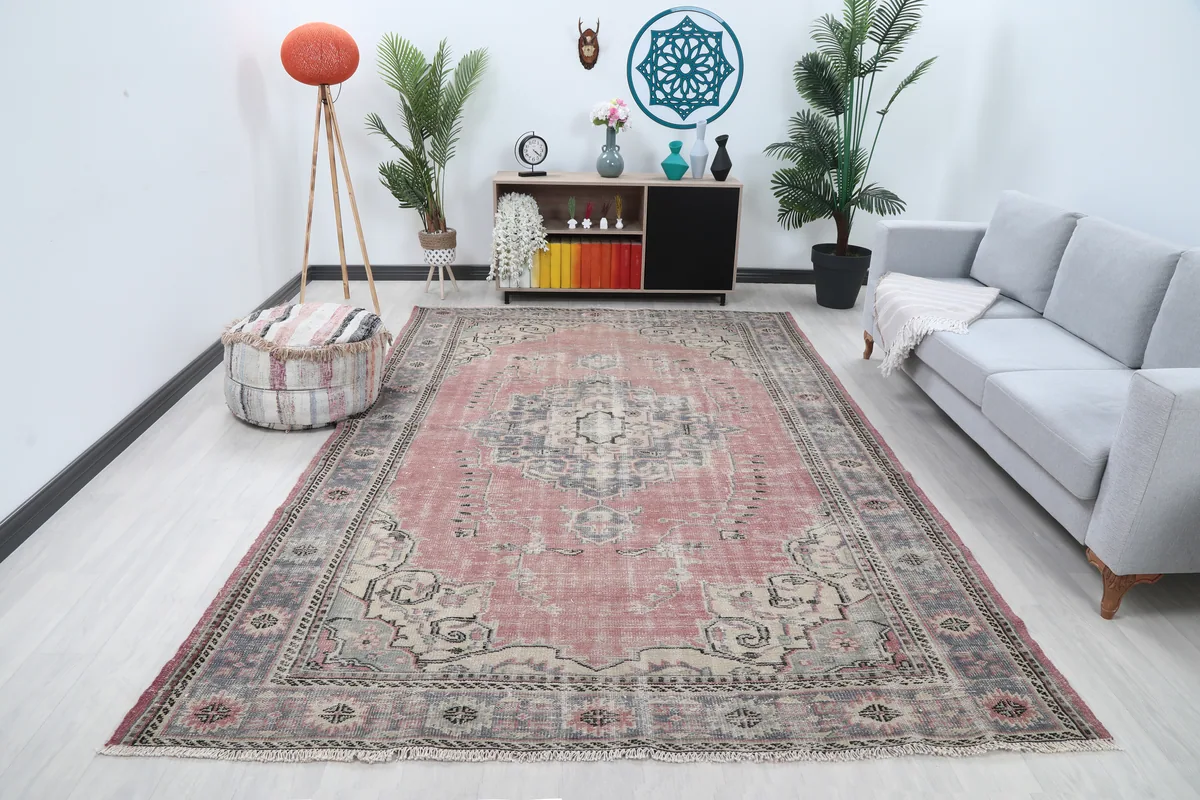 Rose Medallion Anatolian Rug in a living room setting, viewed from an angle.