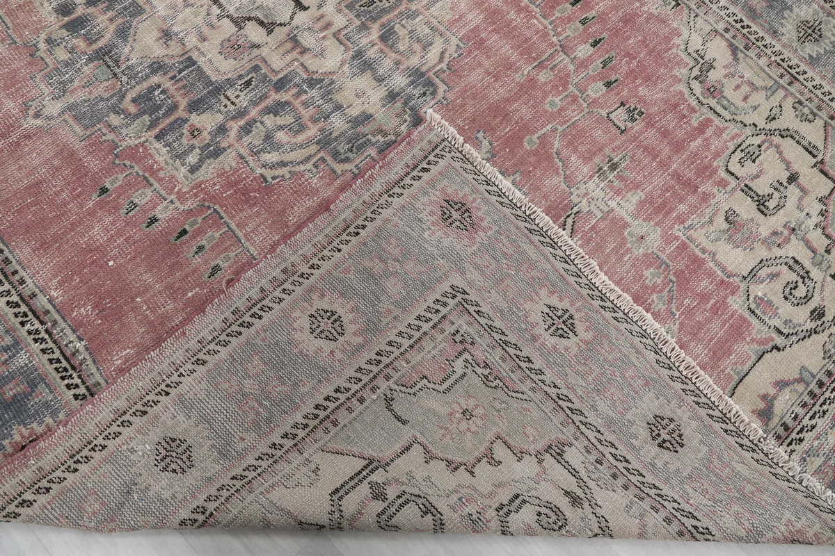 Underside view of the hand-knotted rug, revealing the cotton foundation and construction.