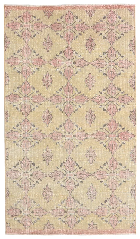 Full top view of the rose and beige geometric vintage Anatolian rug