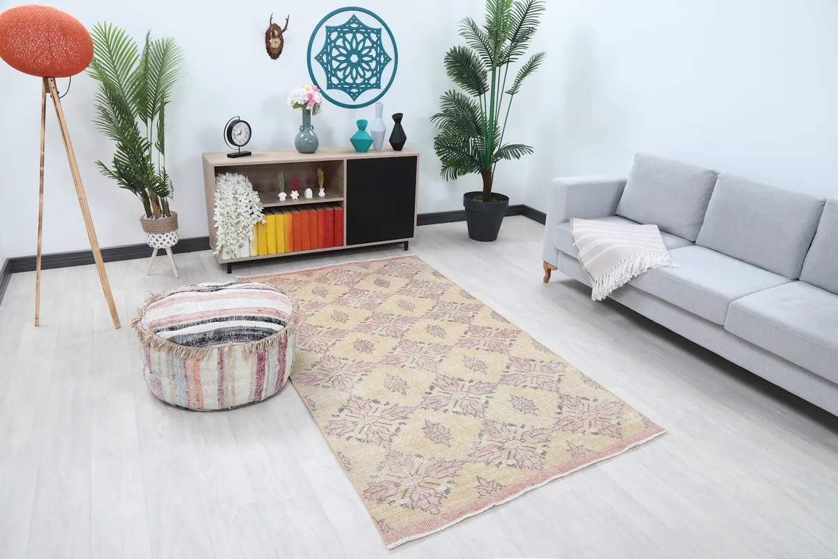 Rose and beige rug placed in a modern living space, showing its size in context