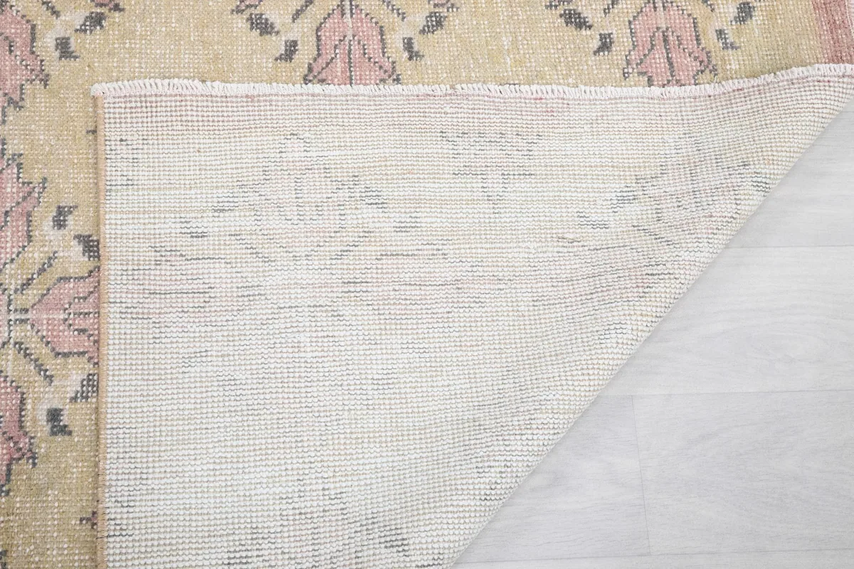 Another view of the rug's back, detailing the weave and construction