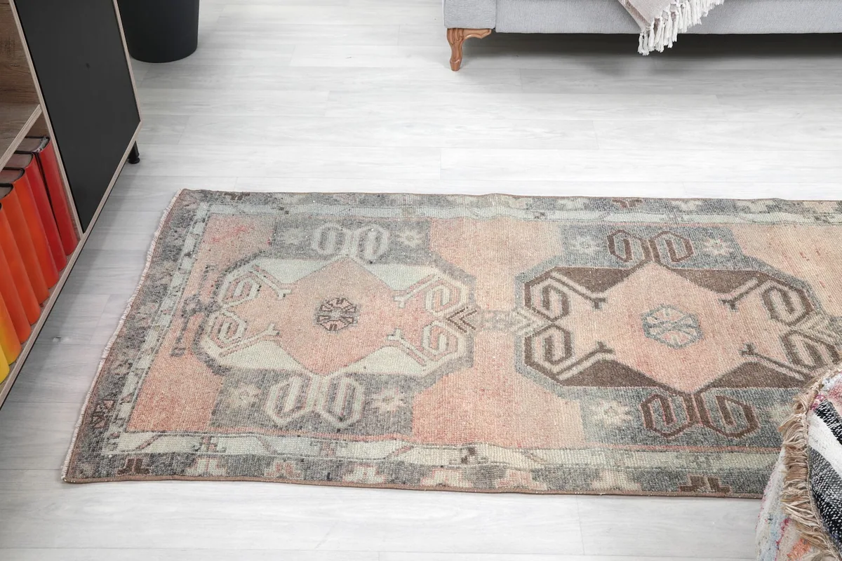Angled view of the runner's length, showing the repeating geometric design elements.