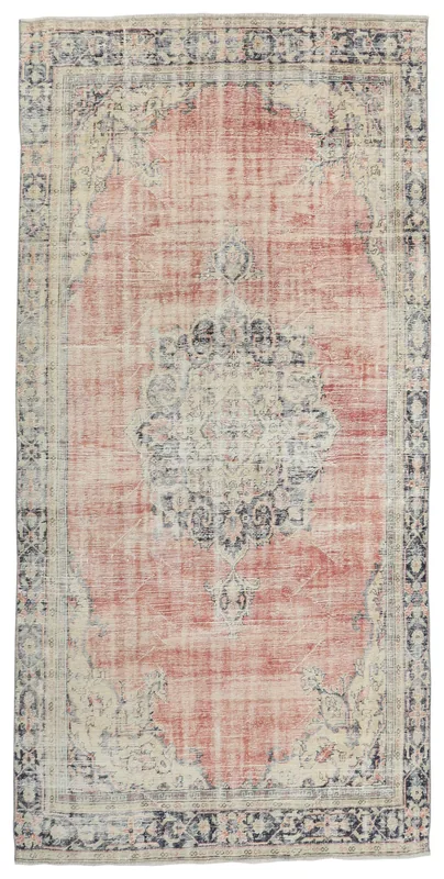 Full top view of the vintage rose, navy, and ivory medallion area rug on a white background.