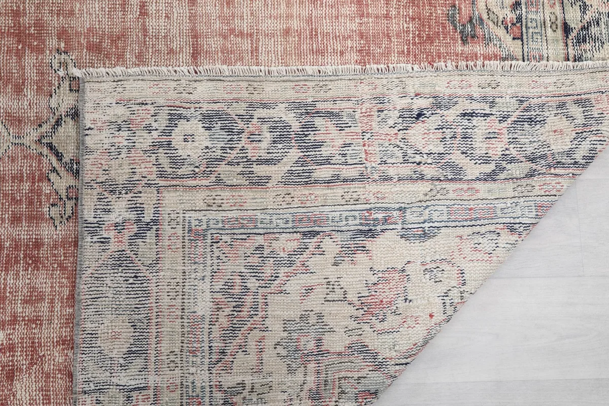 Detailed view of the rug's back, showcasing the tightly woven knots and craftsmanship.