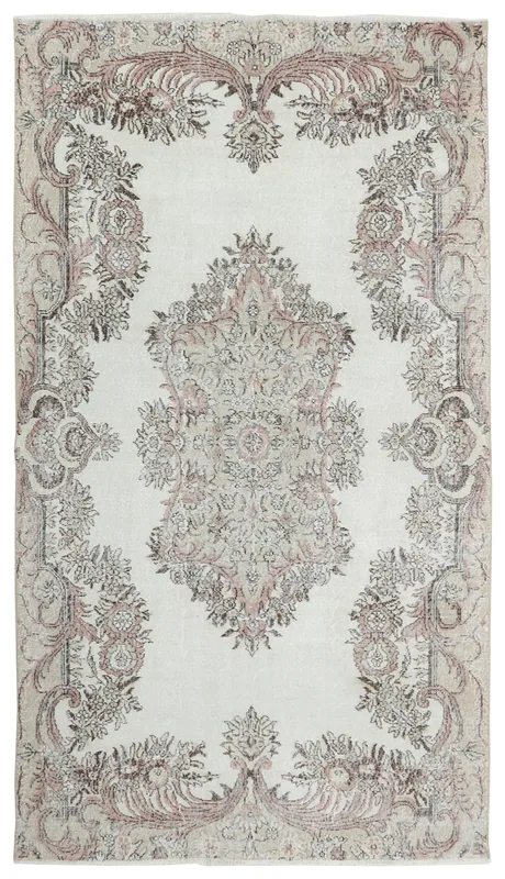 Full top view of the ivory, rose, tan, and gray vintage Anatolian rug
