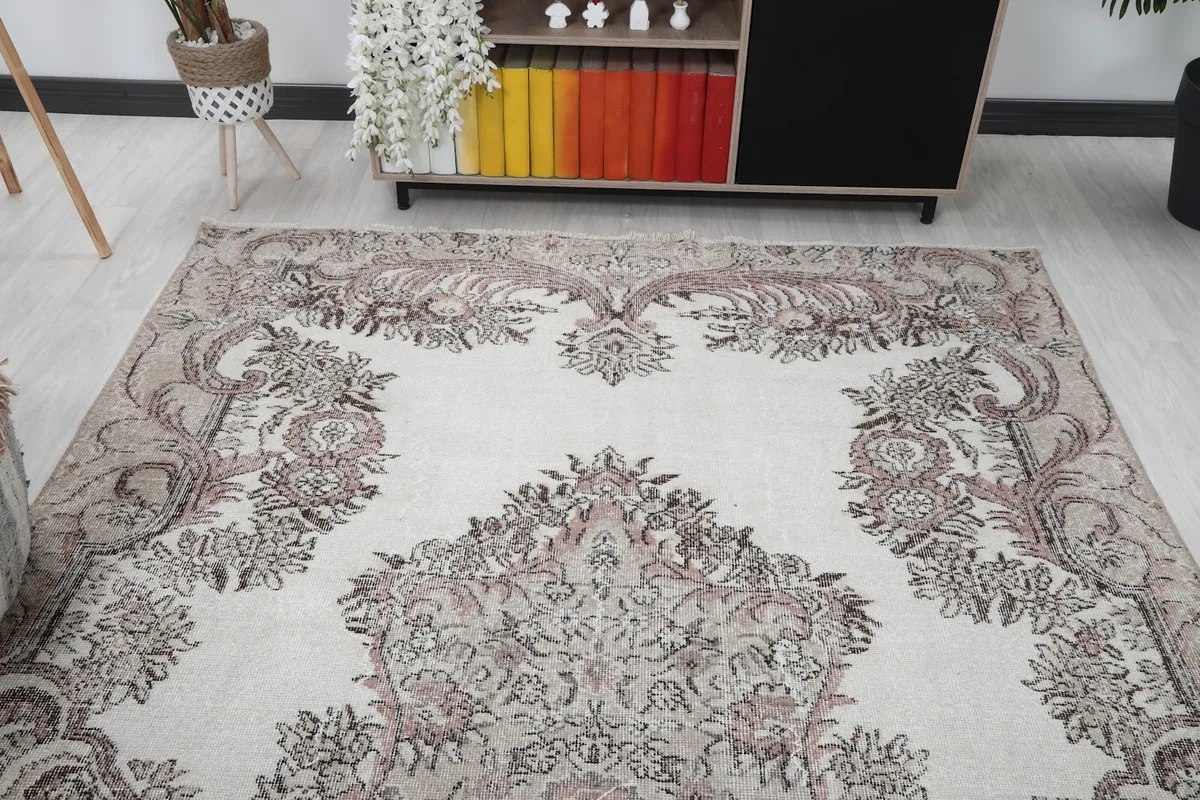 View of the vintage rug from a different angle in the styled living room