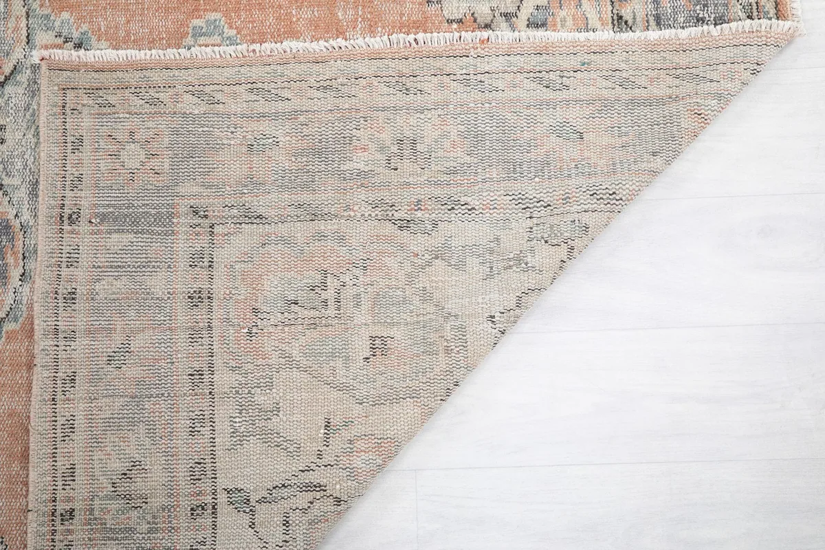 Close-up of the rug's reverse side, revealing the hand-knotted construction