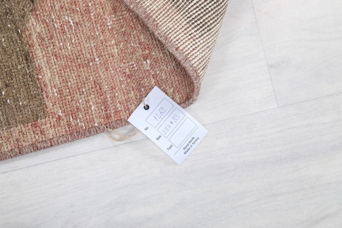 Product tag attached to the rug, displaying item information and origin details.