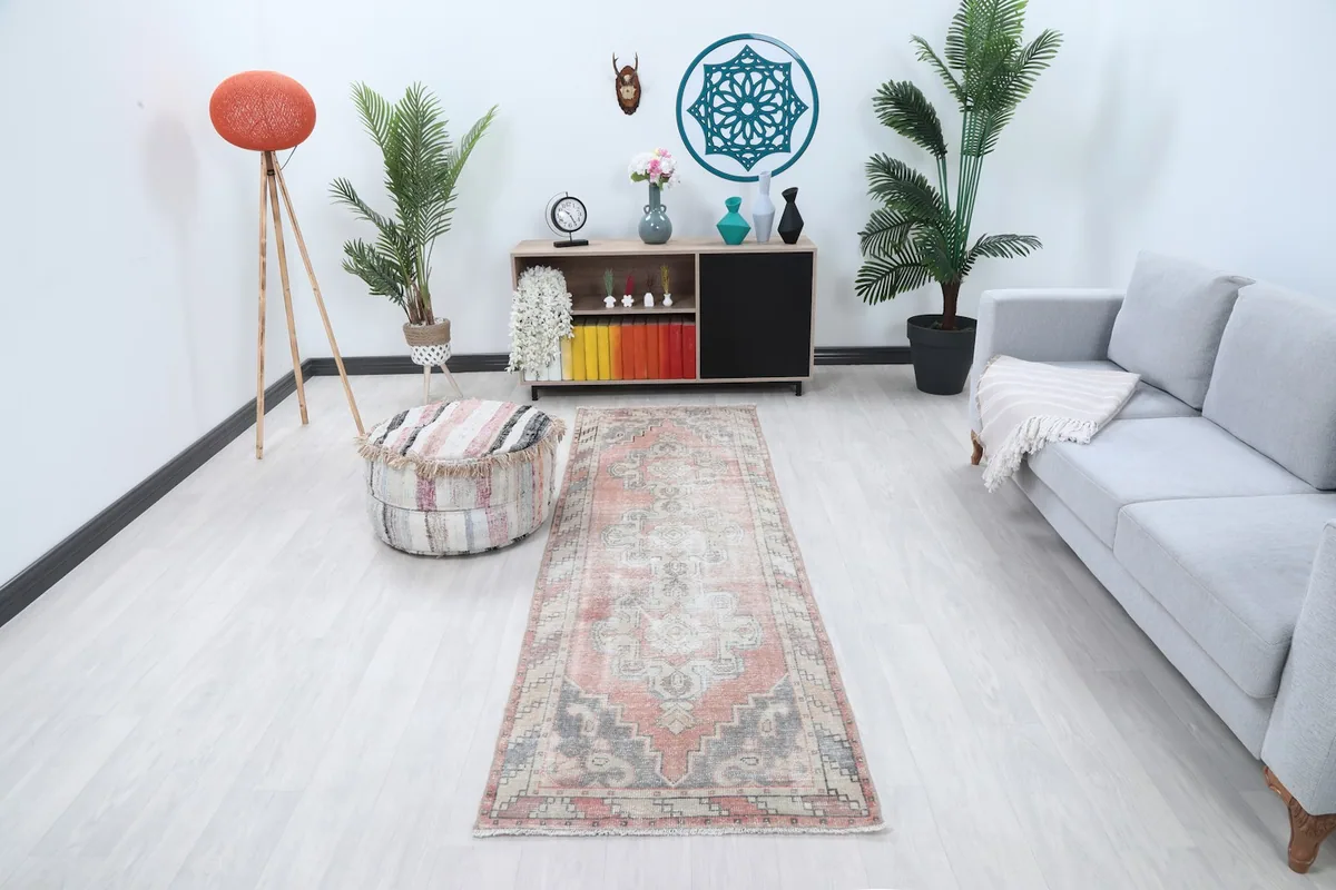 Vintage Anatolian runner displayed in a modern living space with light flooring and furniture