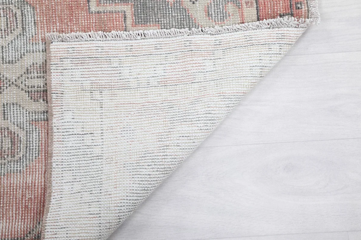 Close-up of the rug's back, showing the consistent hand-knotted construction