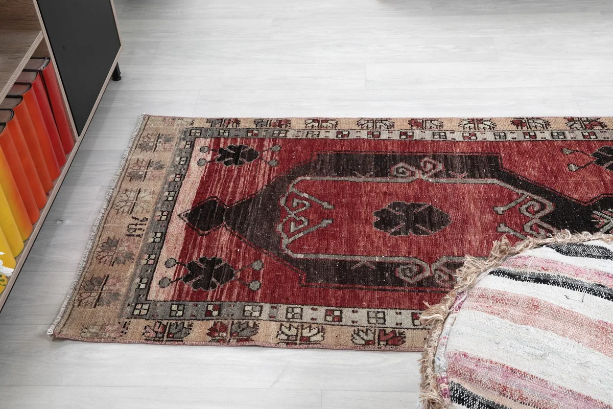Angle view of the runner rug on the floor, highlighting its length and pattern