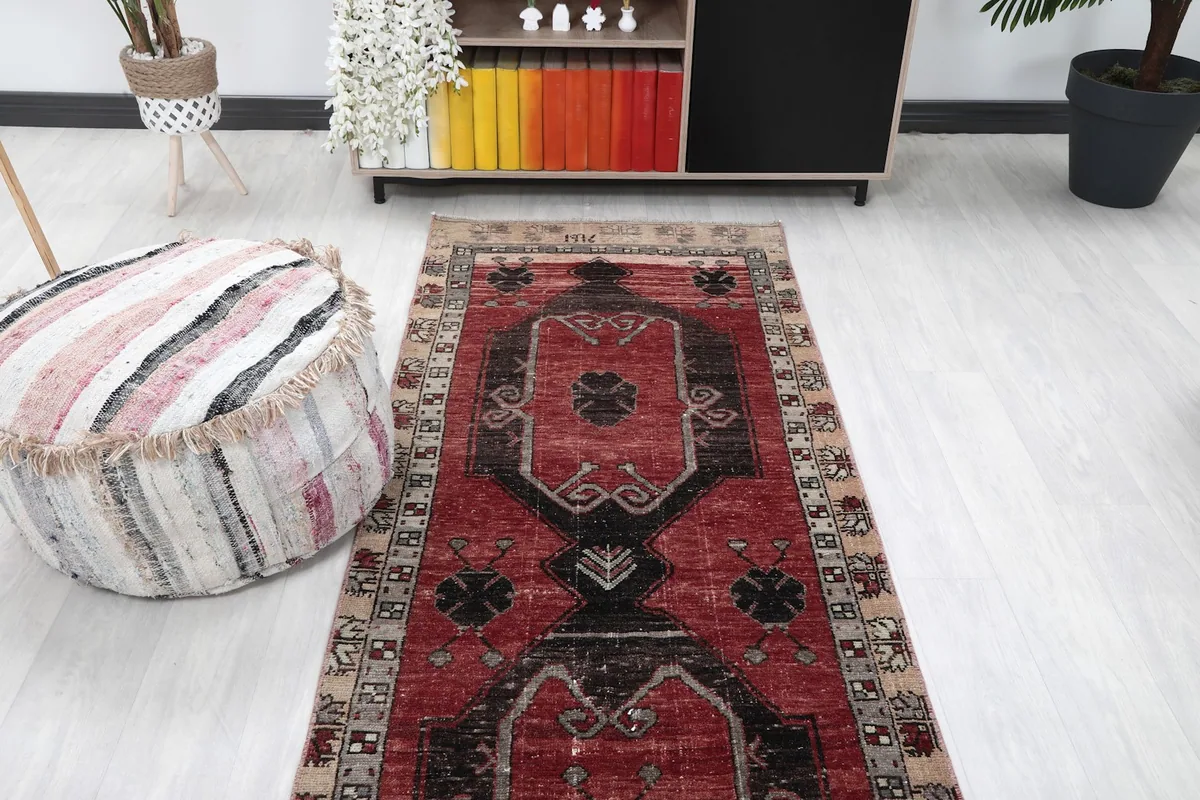 Overhead view of the red runner rug in a room, showing its full length and design