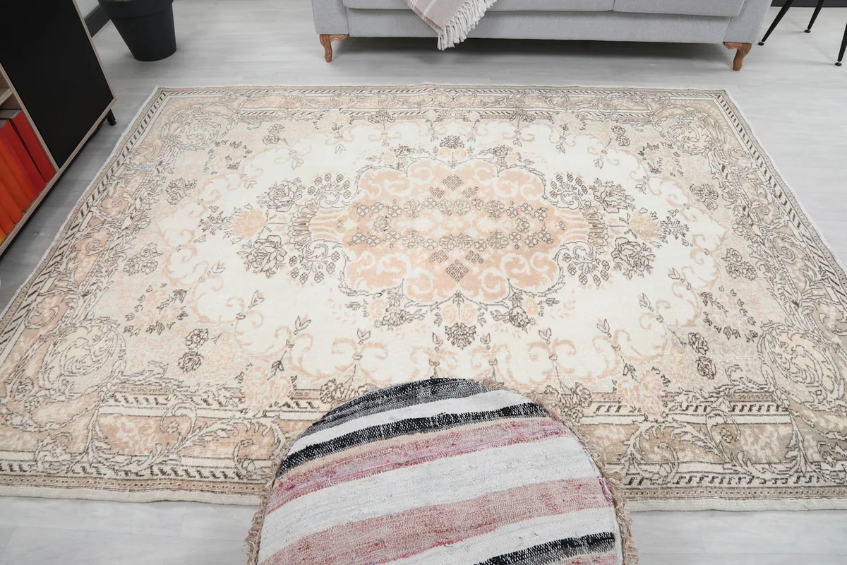 Overhead shot of the rug, emphasizing the central medallion and overall design in the room