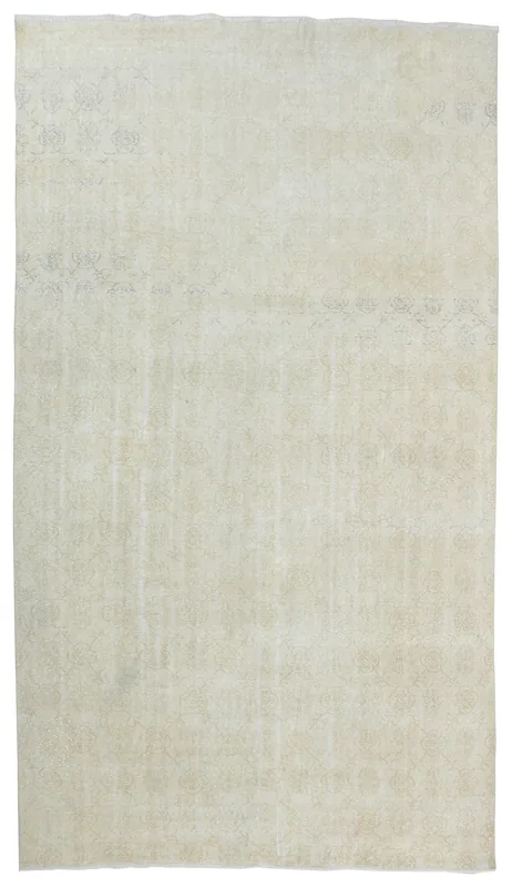Full top view of the 7'3" x 10'11" cream vintage Anatolian area rug on a white background.