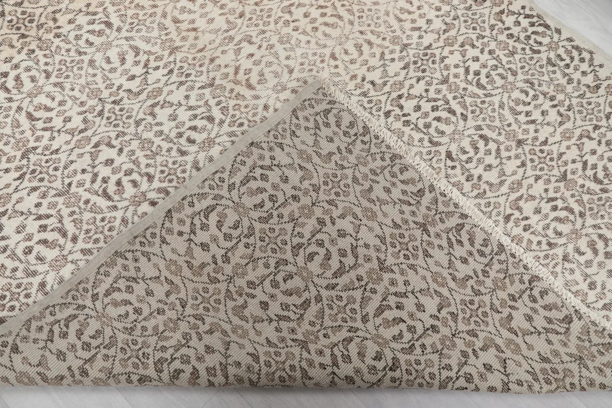 View of the back of the hand-knotted rug, revealing the cotton foundation and knotting