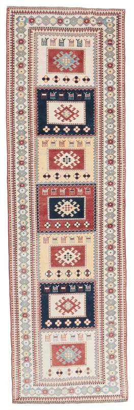 Full overhead view of the 2'9" x 9'6" vintage Anatolian runner rug with cream, red, and navy geometric patterns.