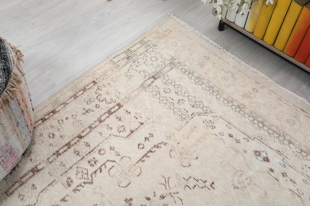 Corner view of the rug, illustrating the border and field patterns from an elevated perspective