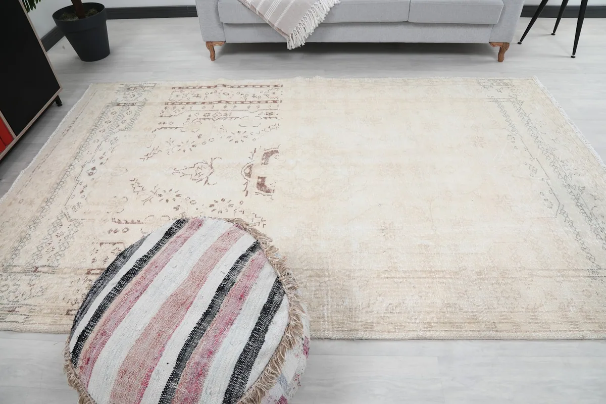 Wide overhead shot of the rug in a room, emphasizing its size and overall appearance