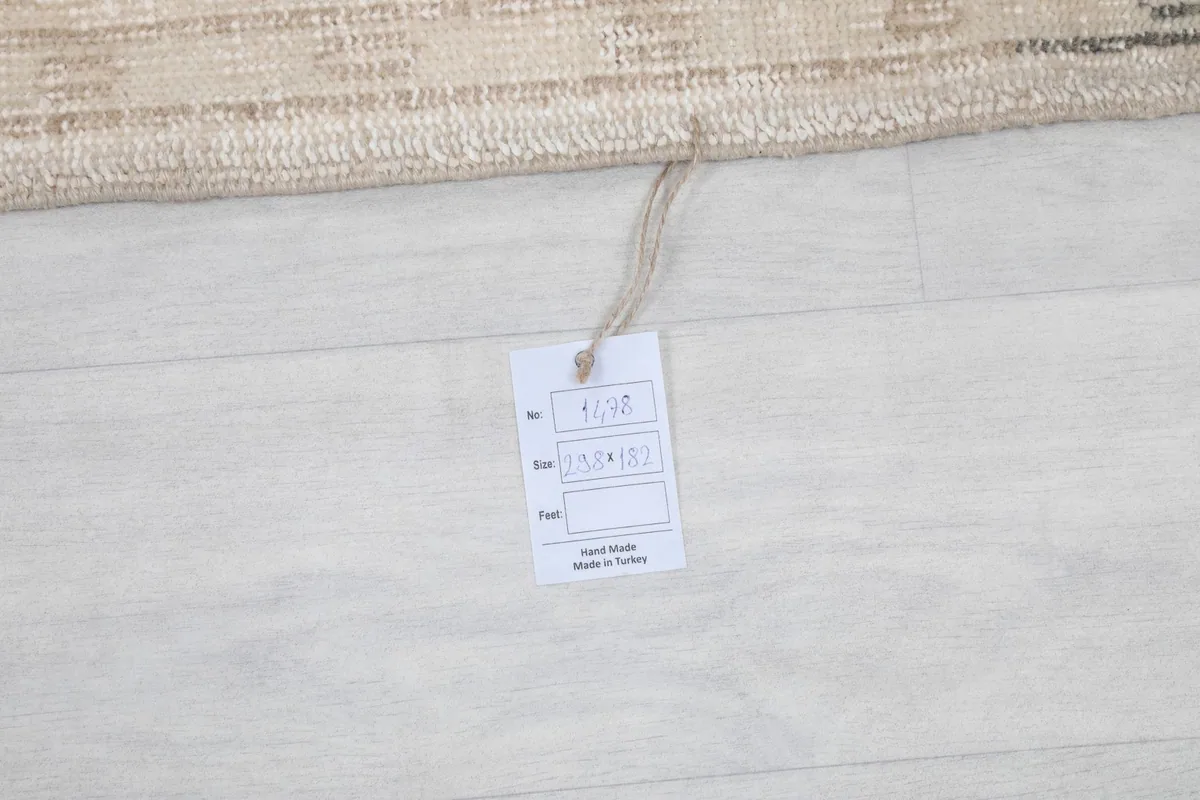 Rug tag displaying product information and 'Hand Made in Turkey'