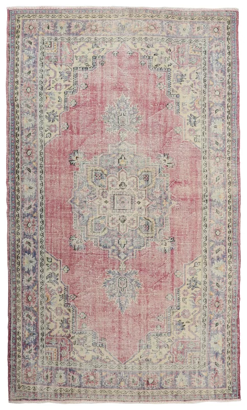 Full top view of the large vintage Anatolian rose medallion area rug on a white background