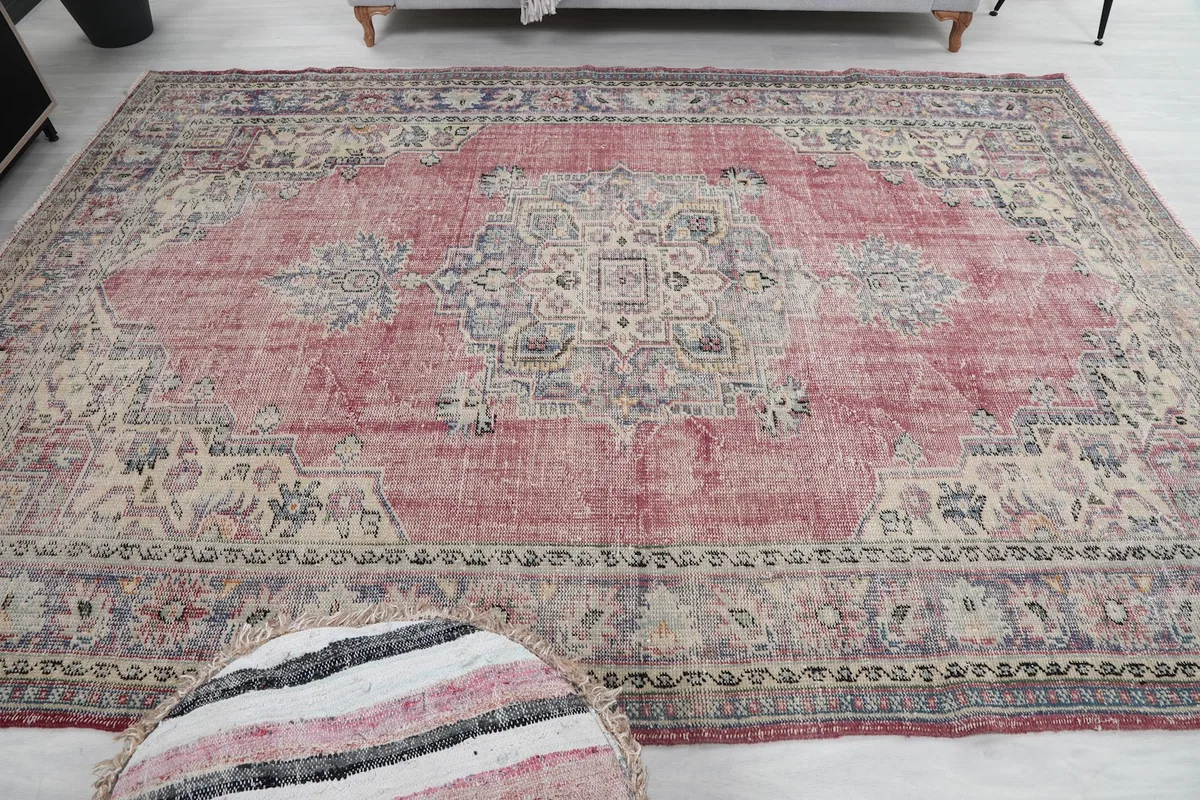 Overhead view of the entire rug in a room, emphasizing the medallion and border symmetry