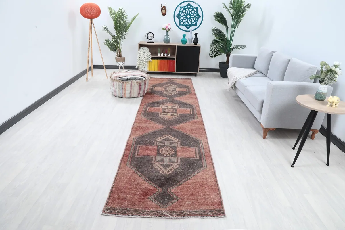 Vintage runner rug displayed in a bright hallway setting with modern furniture.