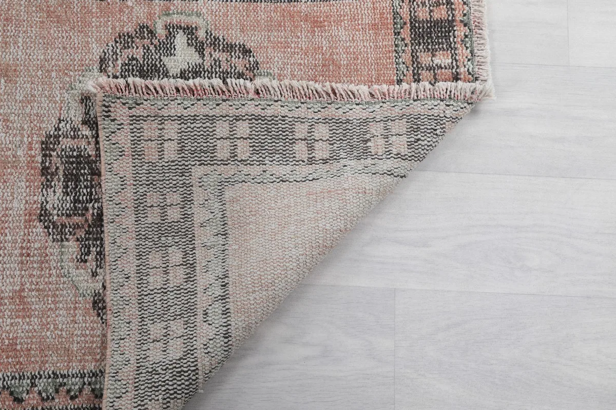 Another view of the rug's reverse, showing the tight hand-knotted construction