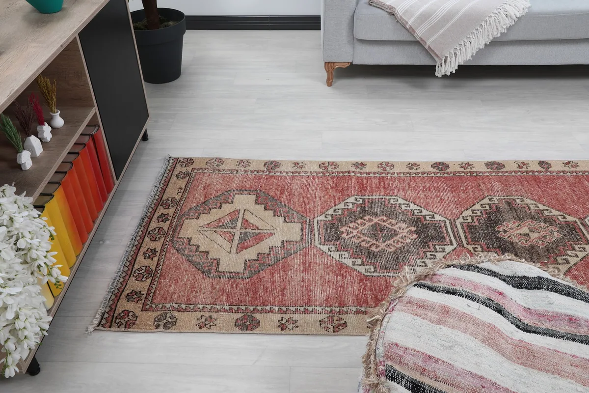 Angled view of the rust runner rug, showing its length and placement in a room