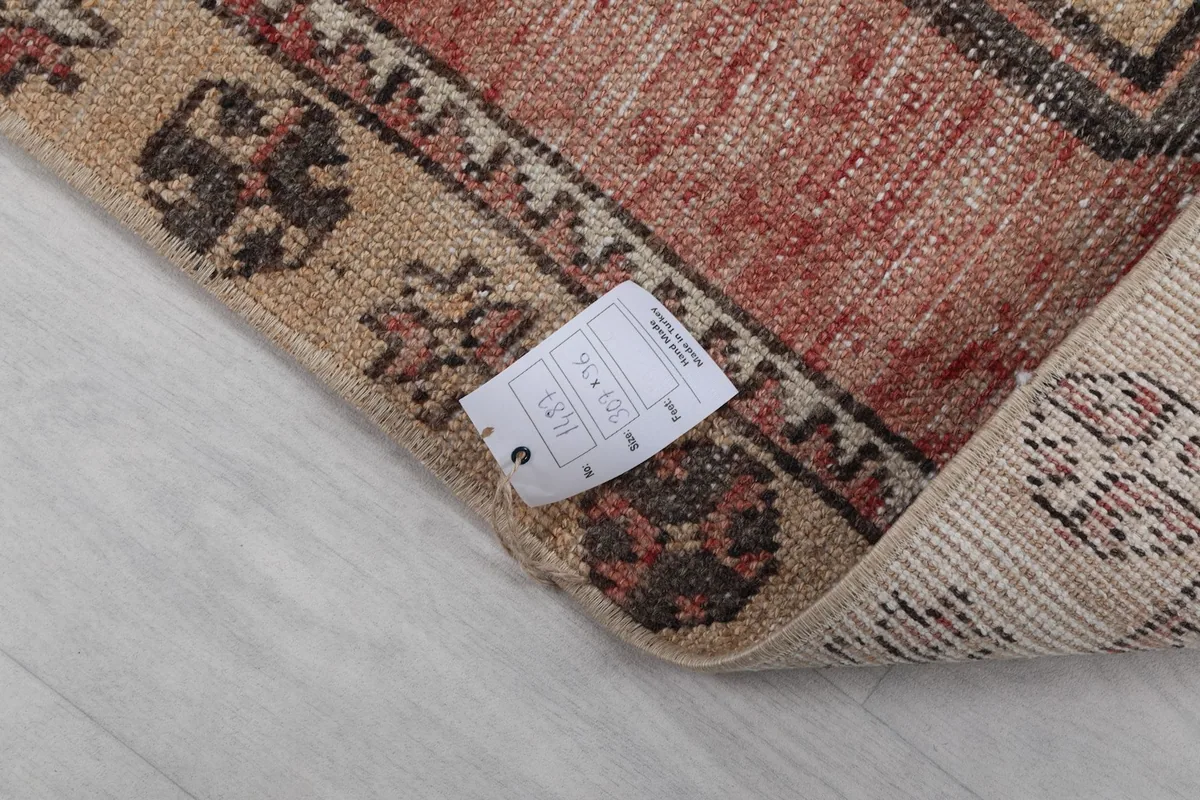 Corner of the rug with a product information tag visible on the reverse side