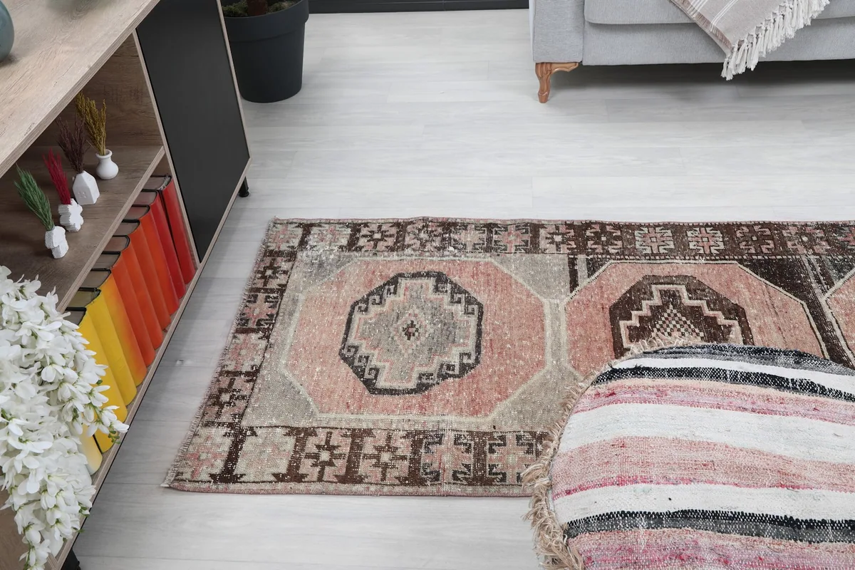 Runner rug partially under a sofa, showing its use in a living area