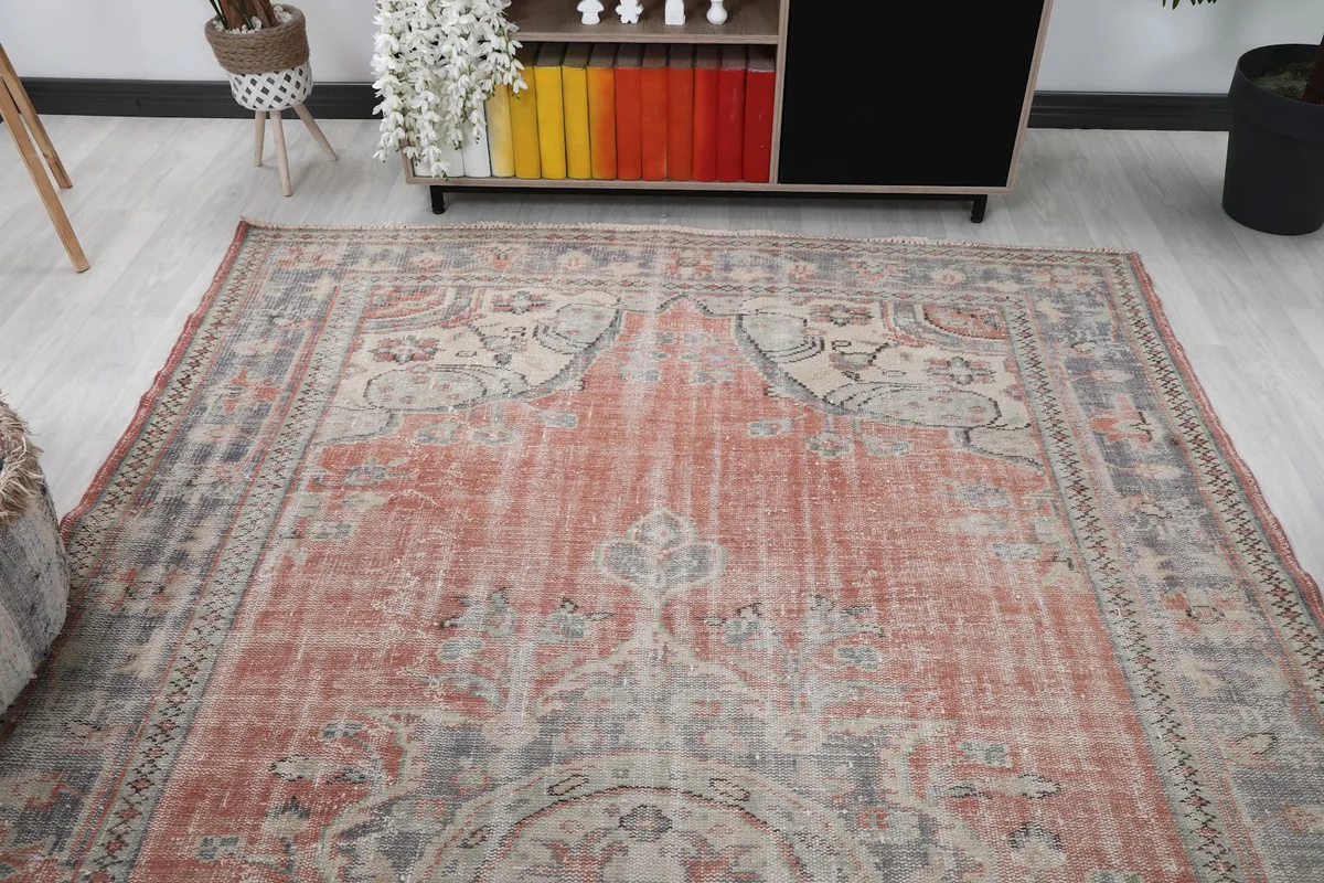 Overhead angled shot showing the full length of the rug and its consistent patina