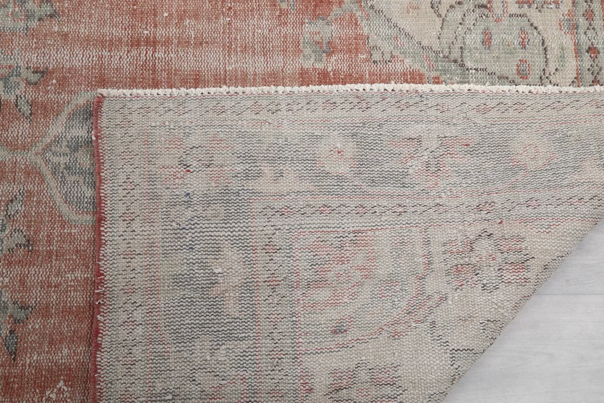 Close-up of the rug's underside, revealing the tightly woven cotton foundation