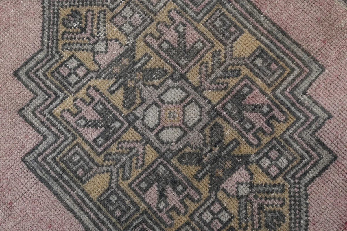 Close-up of the intricate patterns within the central geometric medallion
