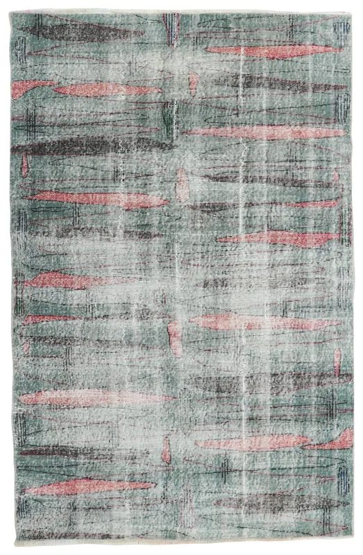 Full top view of the 4'11" x 7'7" green and rose abstract vintage Anatolian rug
